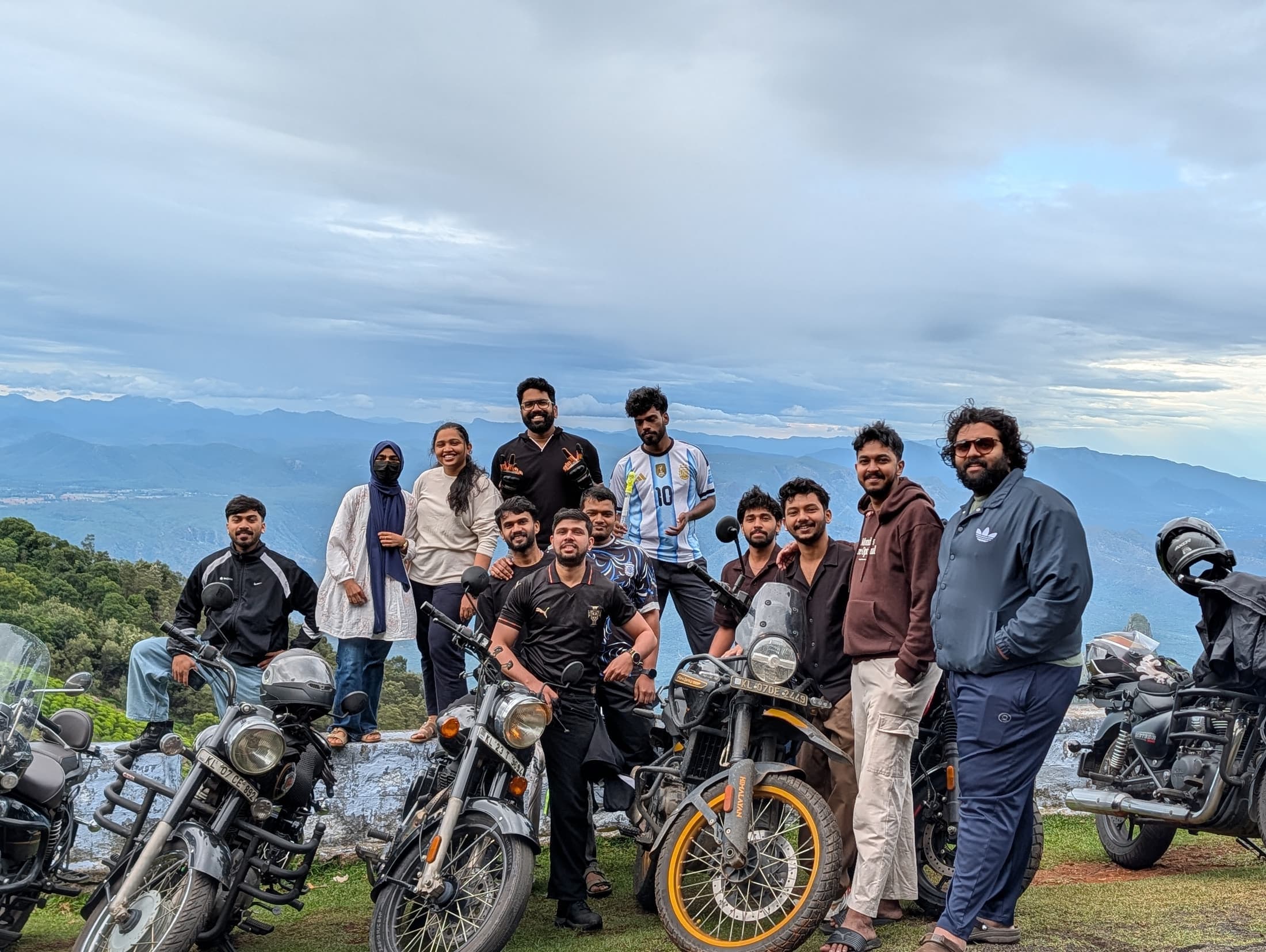 The team with their motorcycles at a viewpoint