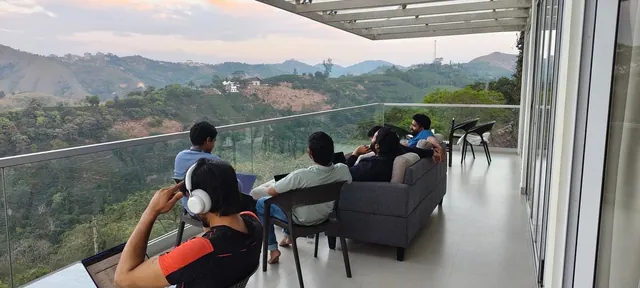 Laptops open on a balcony at dusk